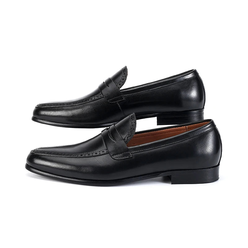 Julian's |Pair of black leather loafers on a white background