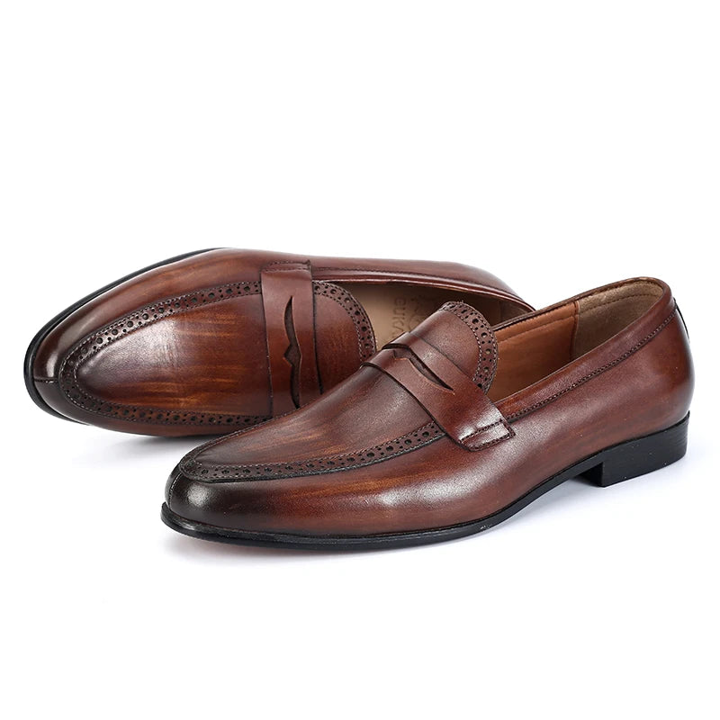 Julian's Pair of brown leather loafers on a white background